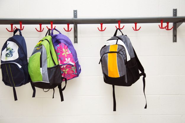 backpacks-hanging-on-hooks